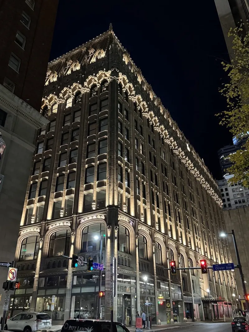 The Union Trust Building&rsquo;s Gothic facade lit up at night