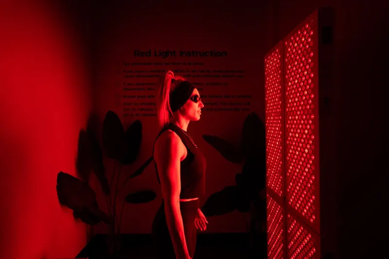Member in the red-light therapy room at Iron 24