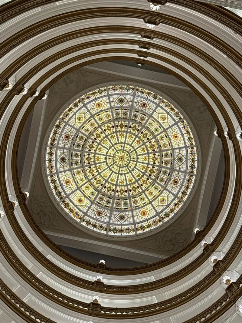 Looking up the Union Trust Building rotunda balconies to the stained-glass dome