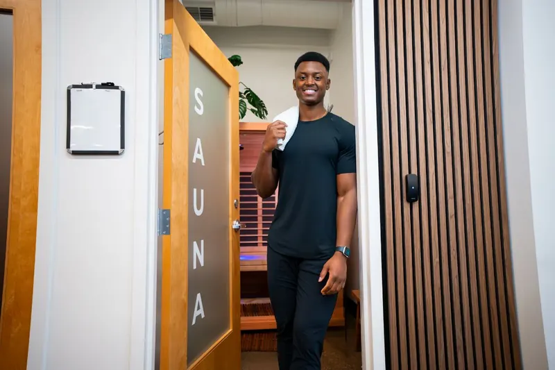 Trainer at the door of the Iron 24 sauna