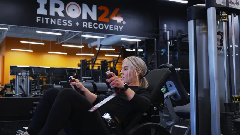 Leg machine workout at Iron 24