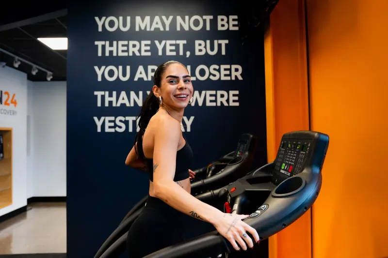 Treadmill beside the Iron 24 motivational quote wall